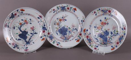 A series of three porcelain famille rose plates, China, Qianlong, 18th century.
