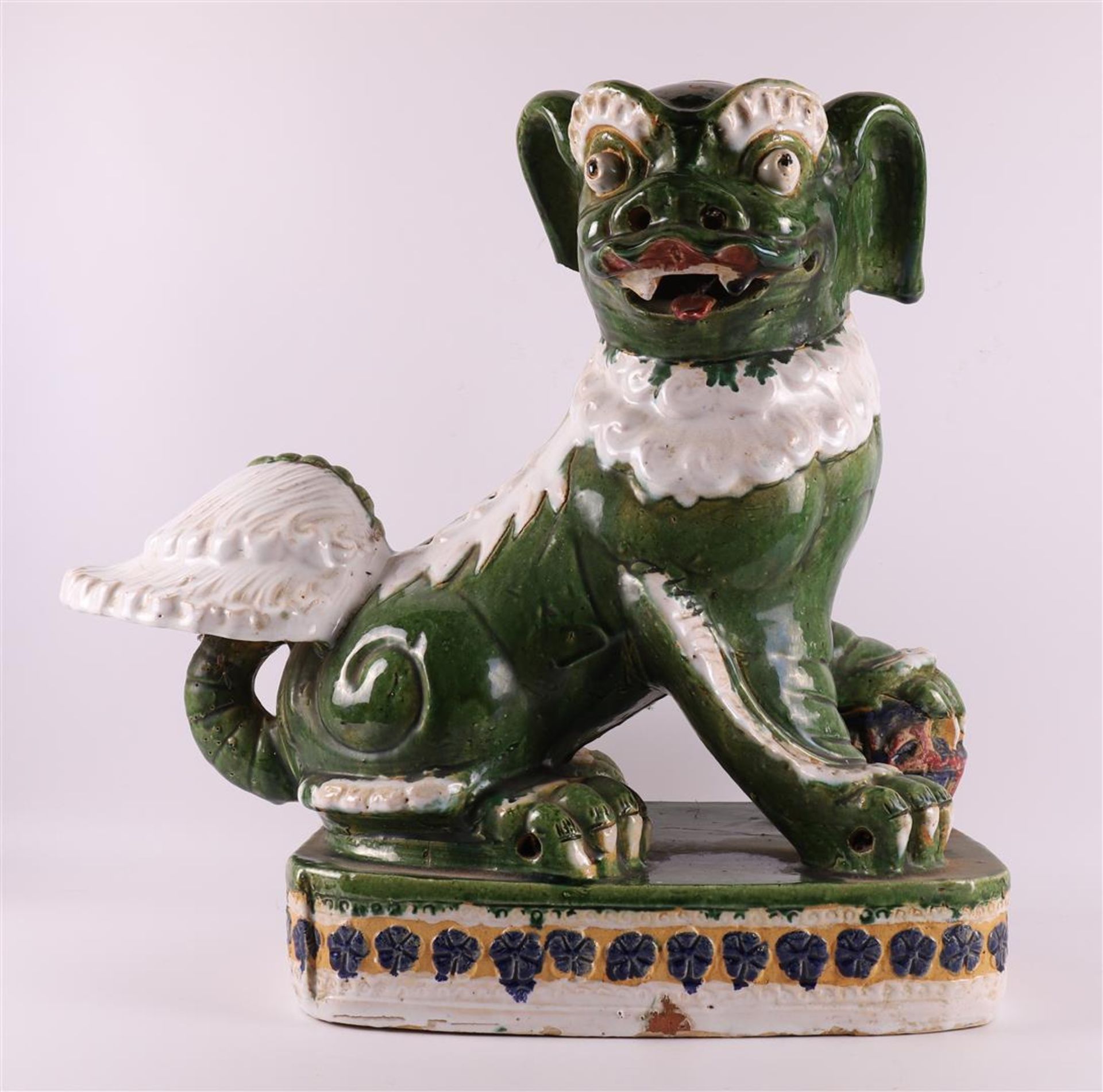 A green/white glazed sitting Dog of Foo, China, circa 1900