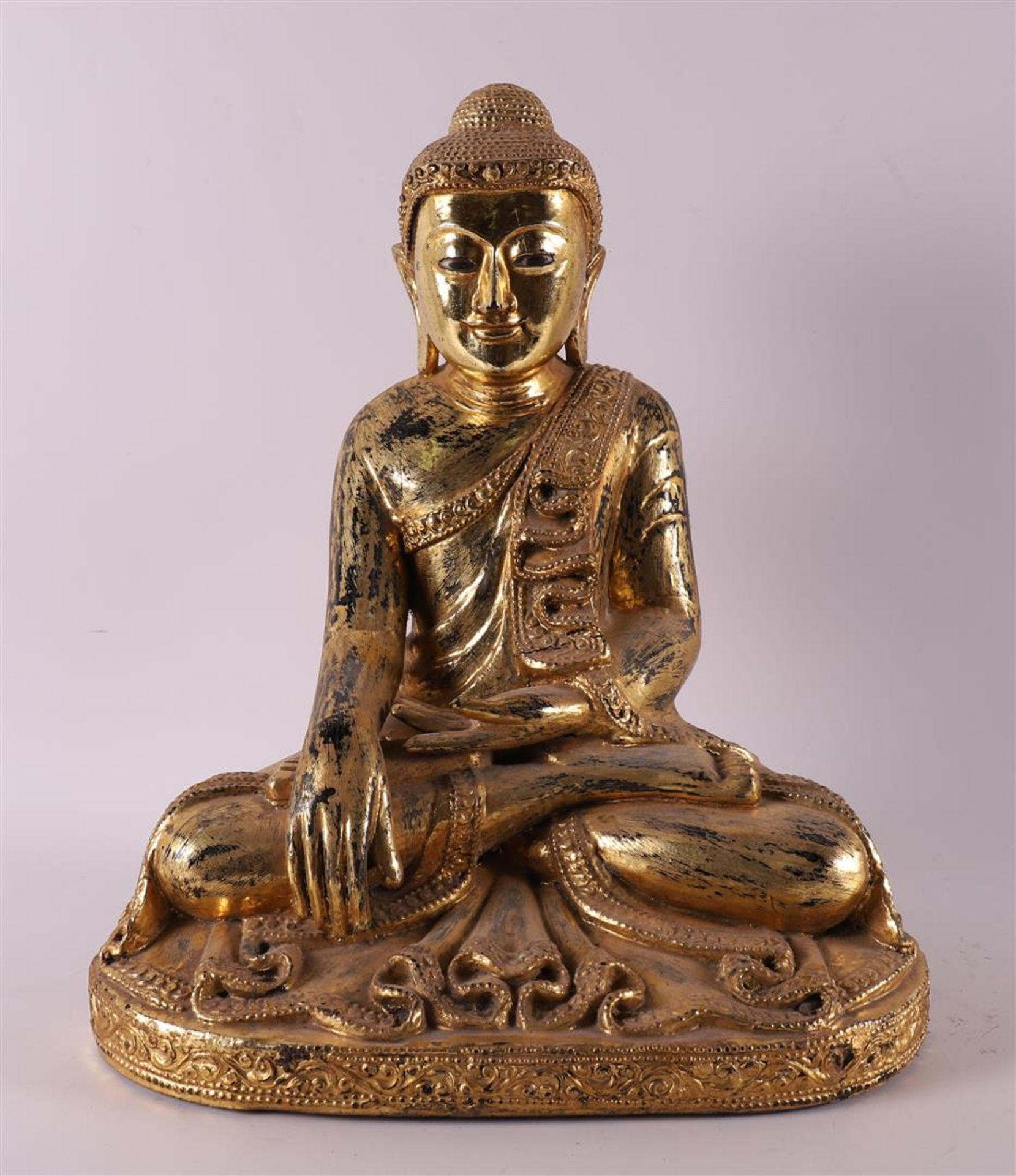 A carved wooden gilded sitting Buddha, Thailand, 20th/21st century.