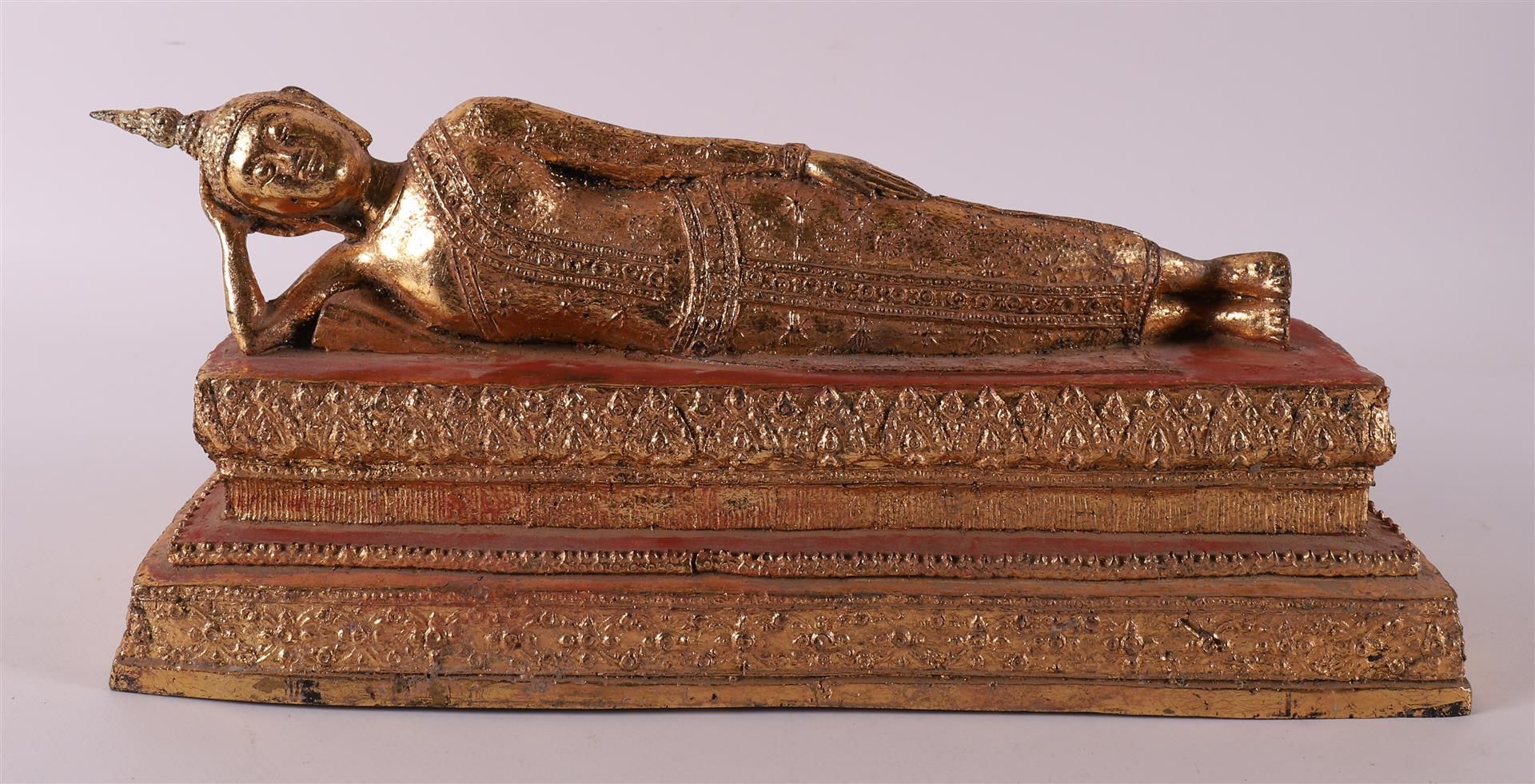 A gilded reclining Buddha, Thailand, 20th century.