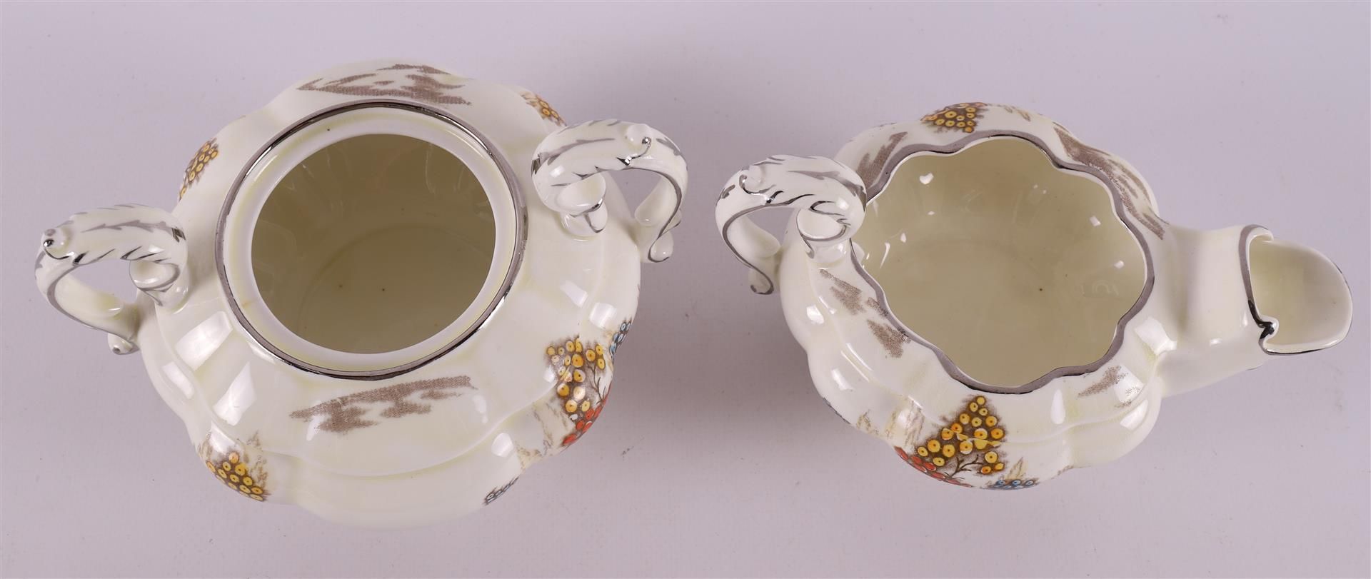 A creamware teapot with sugar bowl and milk jug, England, Stafford, 20th century - Image 9 of 12