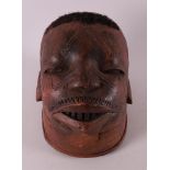 A wooden makonde 'Helmet-mask', Tanzania, Africa, late 20th/early 21st century.