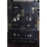 A black lacquer cabinet, China, 20th century.