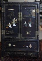 A black lacquer cabinet, China, 20th century.