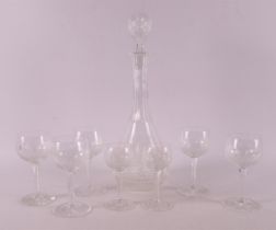 A clear crystal decanter with glasses, 1st half of the 20th century.