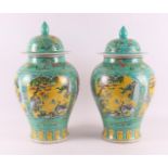 A pair of verte and jaune glazed lidded vases, China, around 1900.