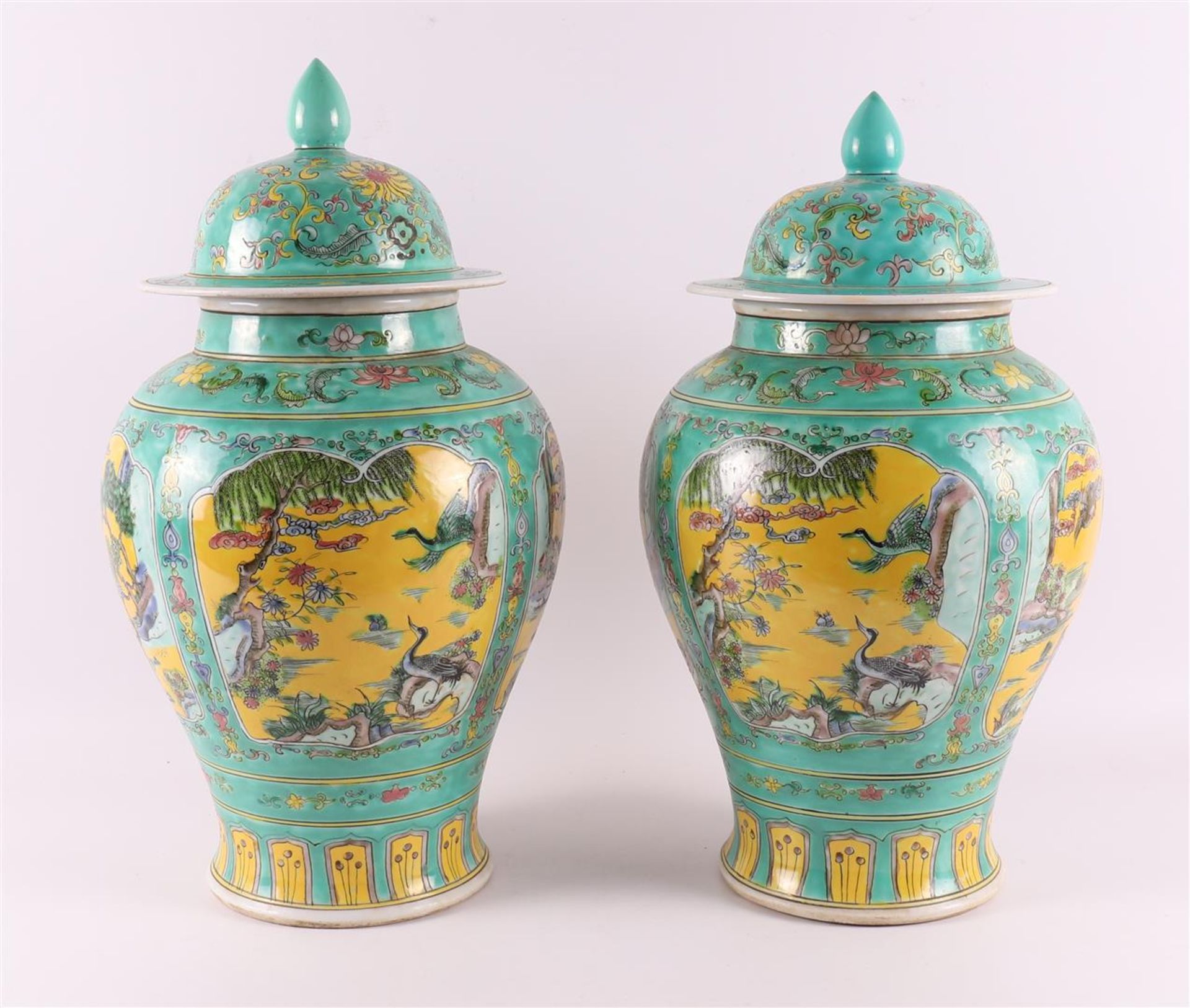 A pair of verte and jaune glazed lidded vases, China, around 1900.