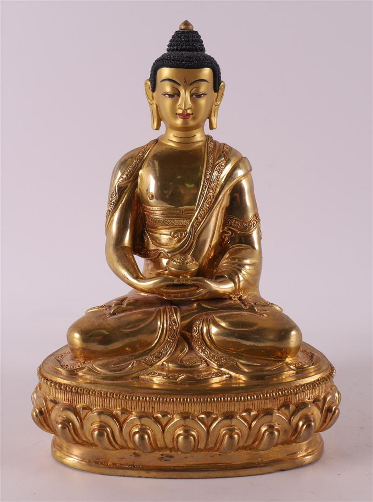 A gilded bronze seated Buddha on a lotus crown, Thailand, 20th/21st century.