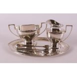 A second grade 835/1000 silver milk jug and sugar bowl on a silver platter, 20th