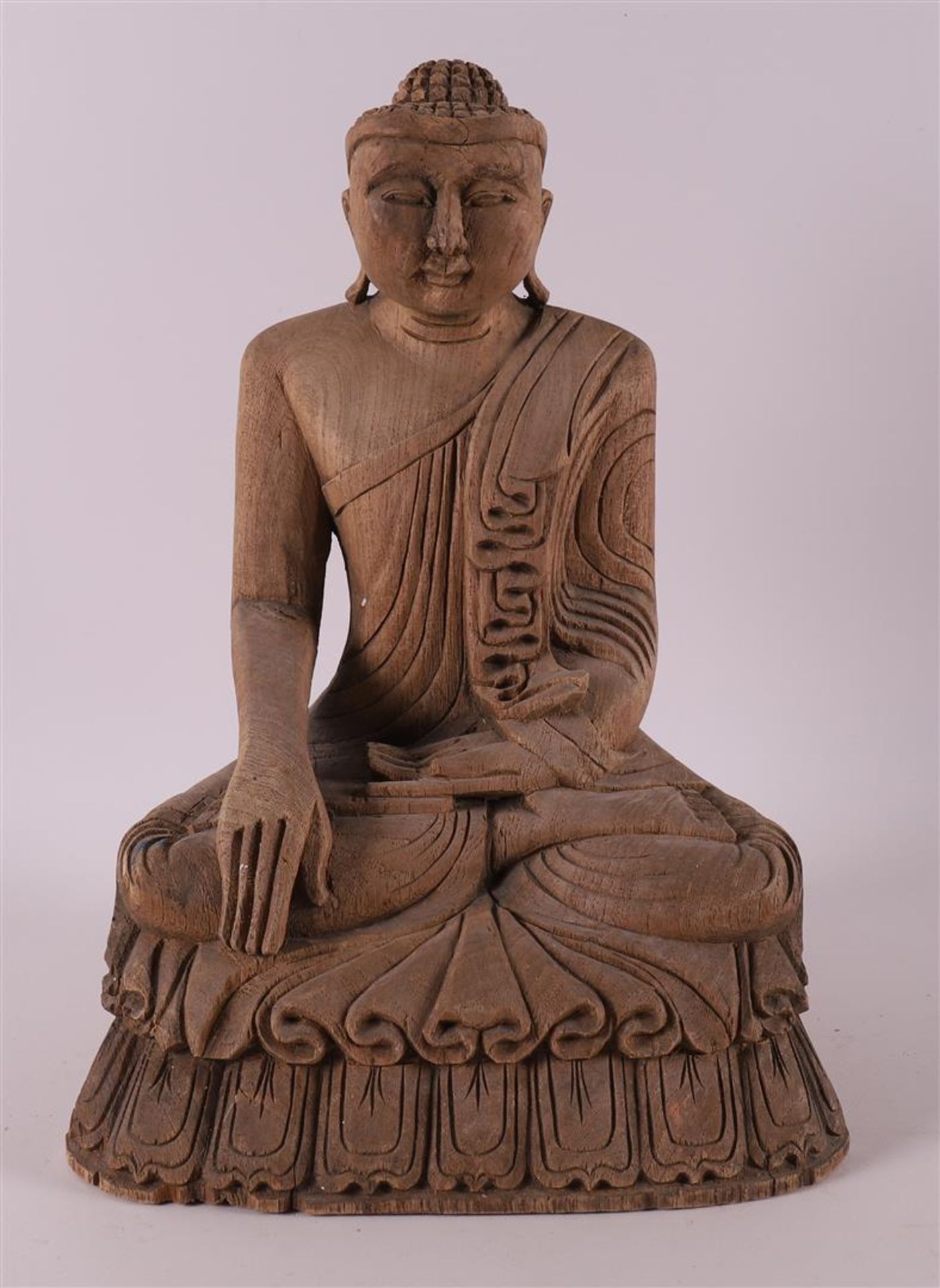 A carved wooden seated Buddha, Nepal/India, 20th century.