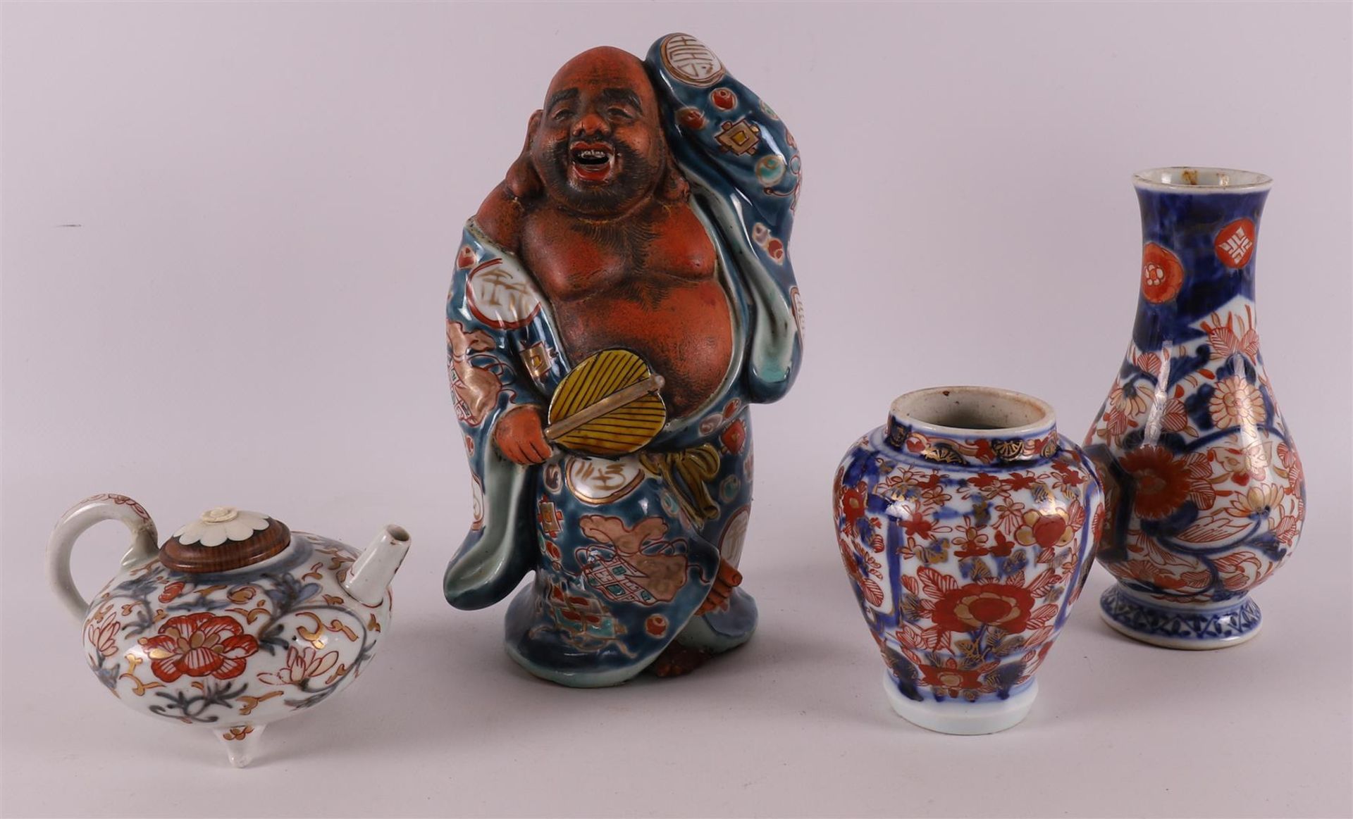 A polychrome porcelain Hotei, Japan, Meiji, around 1900.