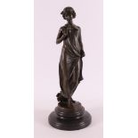 A brown patinated bronze sculpture of a woman after an antique example, 21st cen