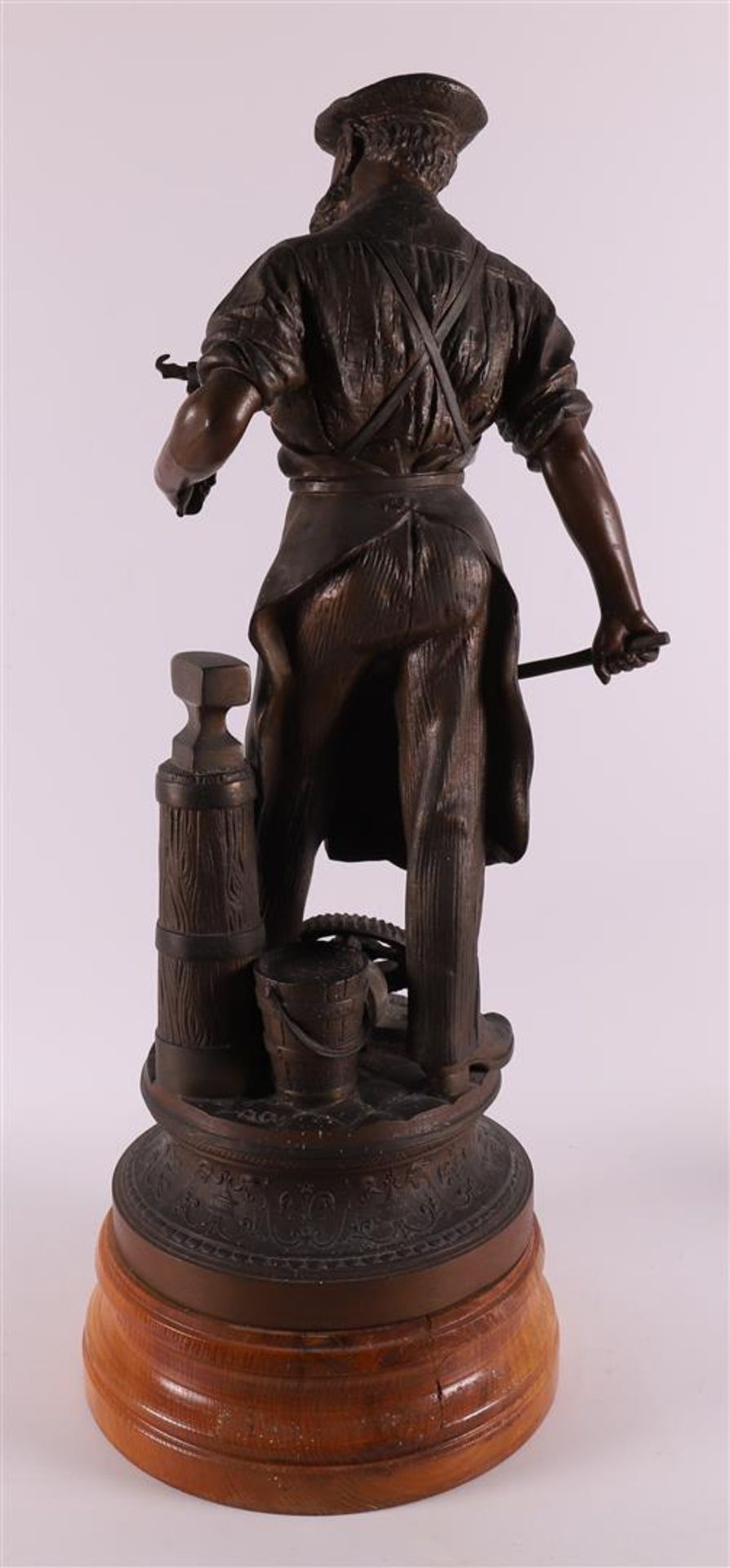 A white metal 'samac' sculpture of a blacksmith, around 1900. - Image 3 of 5