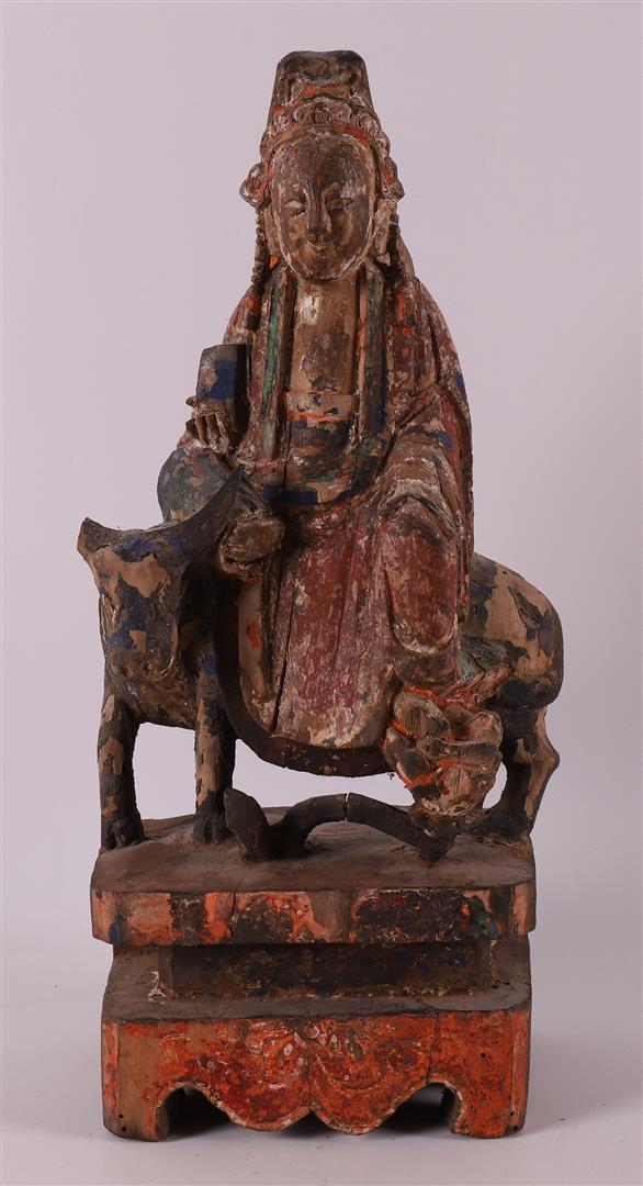 Kwanyin on an ox with traces of polychromy, China, Qing dynasty.