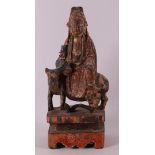 Kwanyin on an ox with traces of polychromy, China, Qing dynasty.