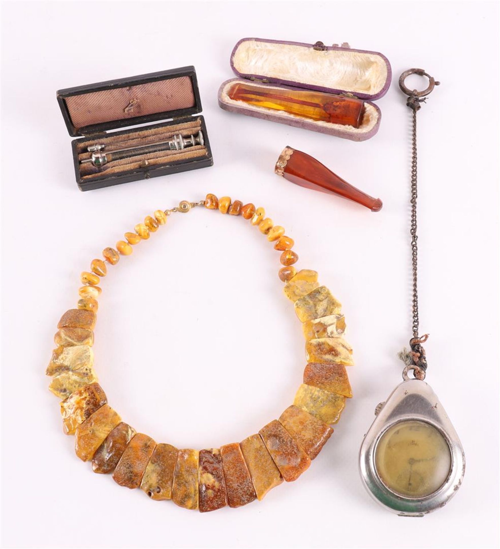 A lot of miscellaneous items, including an amber necklace, cigar pipe with gold 