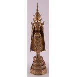 A gilded bronze standing Buddha, Thailand, 19th century or older.