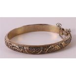A gold-plated silver stiff bracelet with filigree decor