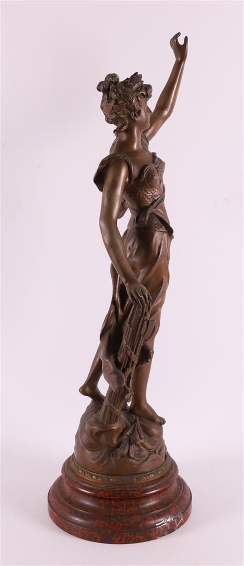 A brown patinated white metal woman 'La Gloire', France around 1900. - Image 3 of 5