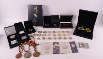 A collection of 50 pieces of various tokens and medals.