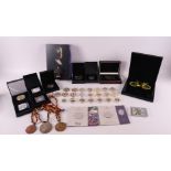 A collection of 50 pieces of various tokens and medals.