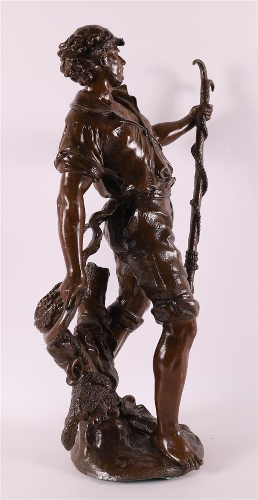 A brown patinated white metal 'samac' sculpture of a fisherman, France, - Bild 2 aus 6