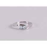 An 18 kt 750/1000 white gold ring with an oval facet cut aquamarine.