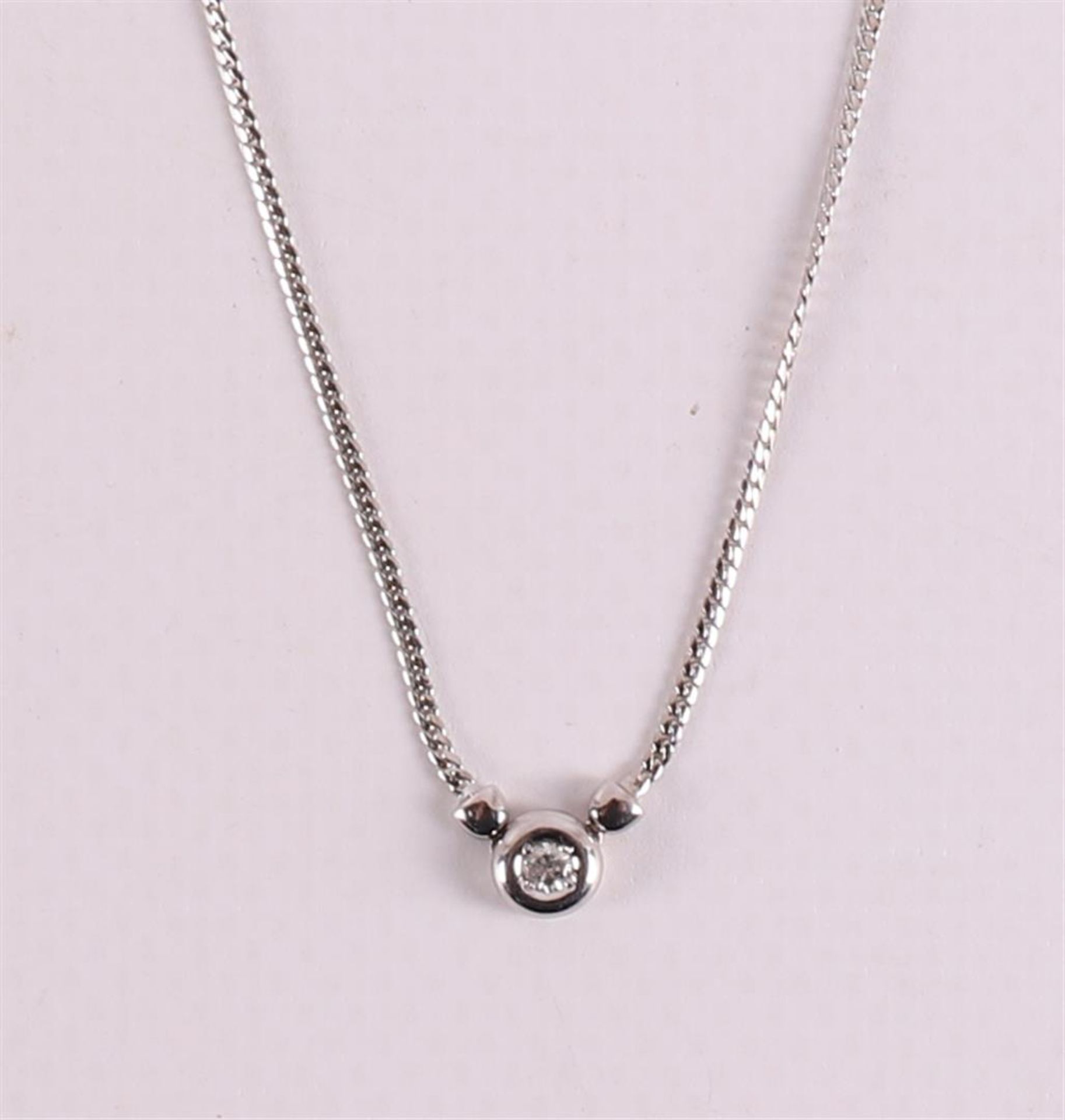 An 18 kt white gold necklace with a brilliant cut diamond. - Image 2 of 2