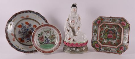 A porcelain seated Kwanyin on a lotus crown, China, mid-20th century.