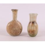 A Roman glass vase and bottle, 2nd - 4th century.