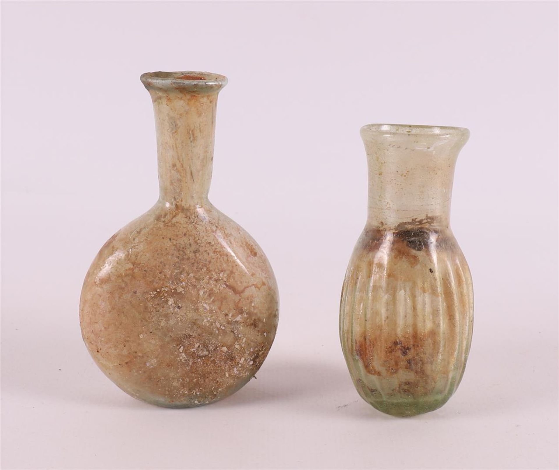 A Roman glass vase and bottle, 2nd - 4th century.