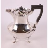 A silver teapot with ebony handle, England, year letter 1902