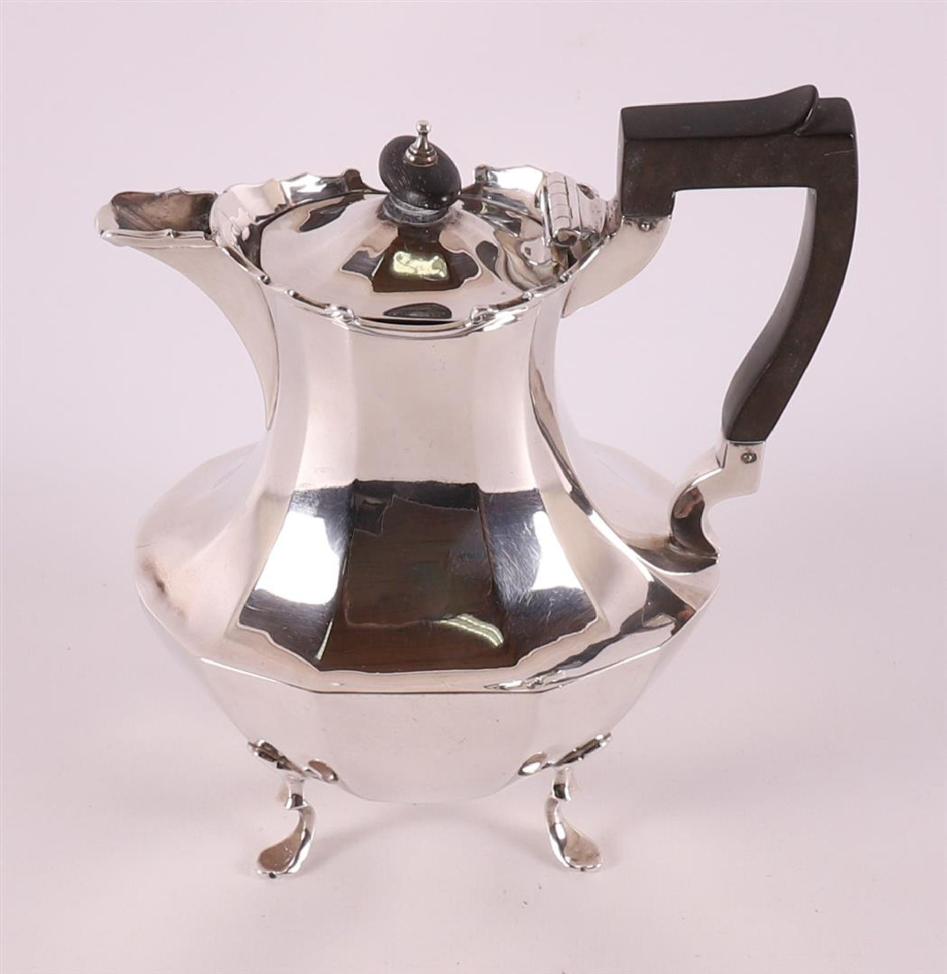 A silver teapot with ebony handle, England, year letter 1902