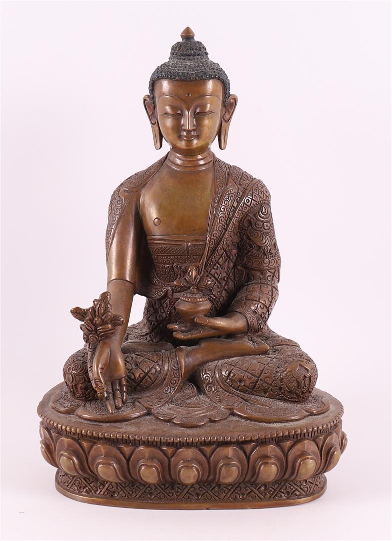 A bronze seated Buddha in lotus position on lotus crown, India, 20th century