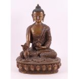 A bronze seated Buddha in lotus position on lotus crown, India, 20th century