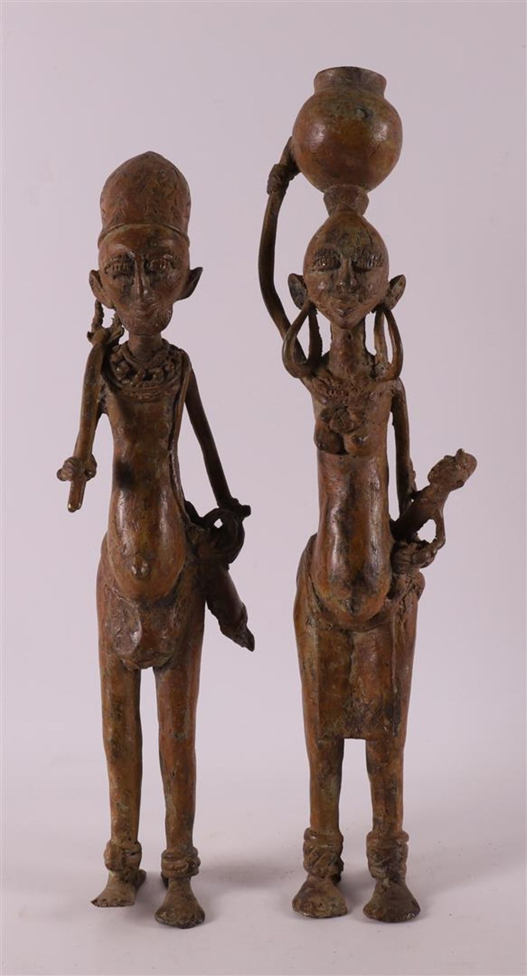 A Benin bronze man and woman, Nigeria, Africa, 2nd half of the 20th century.