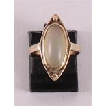 A 14 kt yellow gold women's ring, set with cabochon cut colored stone.