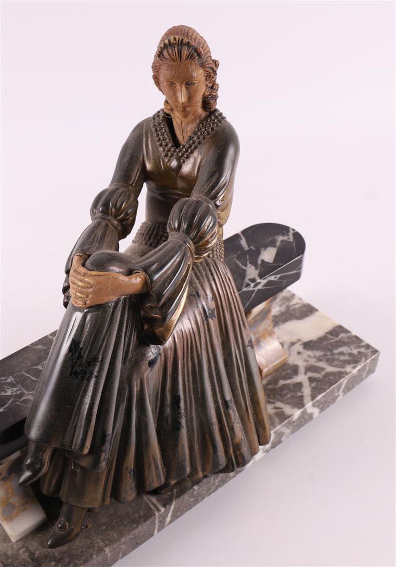 A white metal Art Deco sculpture of a lady on a bench, France, ca. 1920. - Bild 7 aus 7