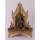 A silver-plated bronze Buddha on a loose gilded throne, India, 19th/20th century