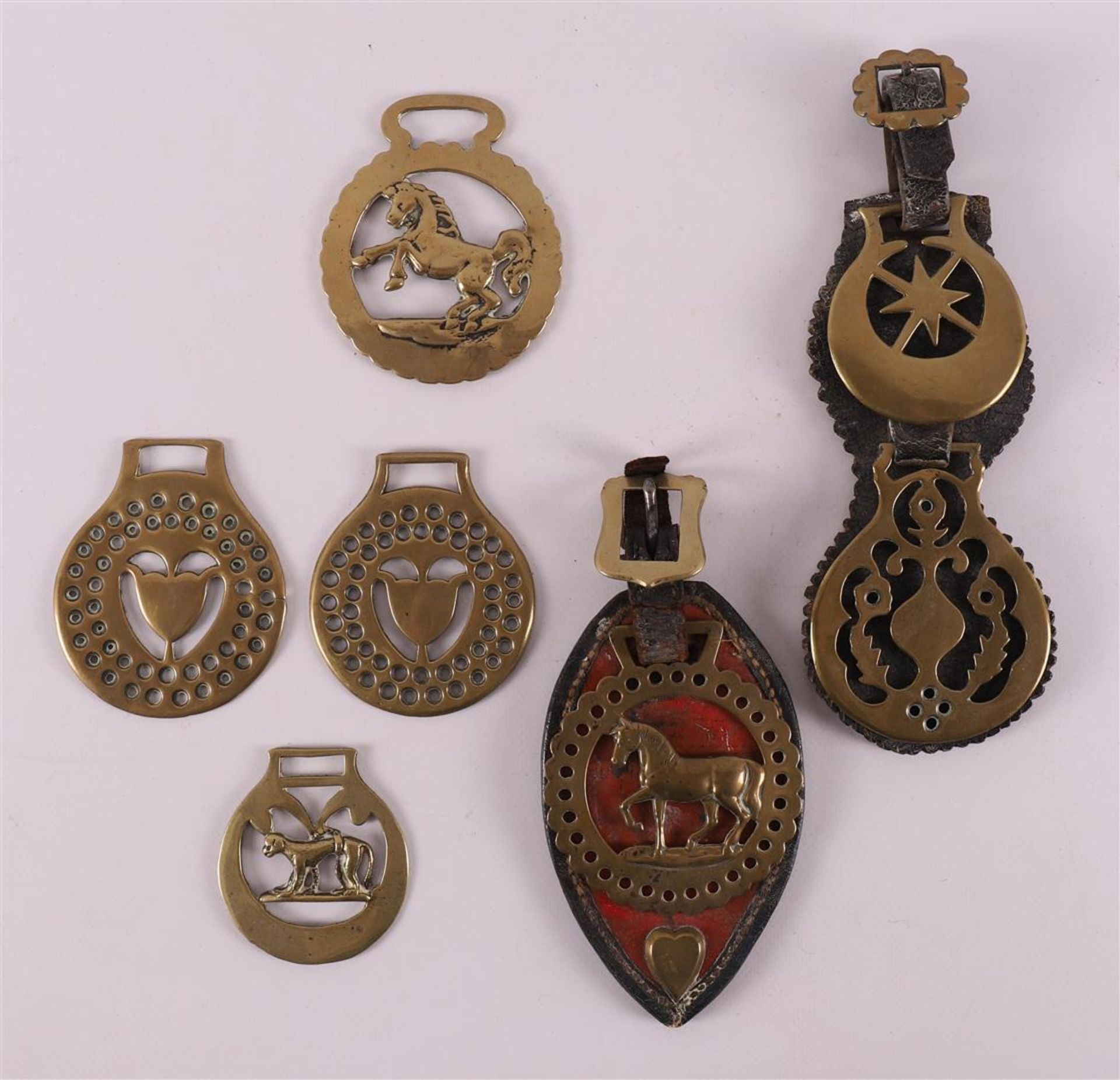 A lot of various brass horse medallions, England, 19th century.
