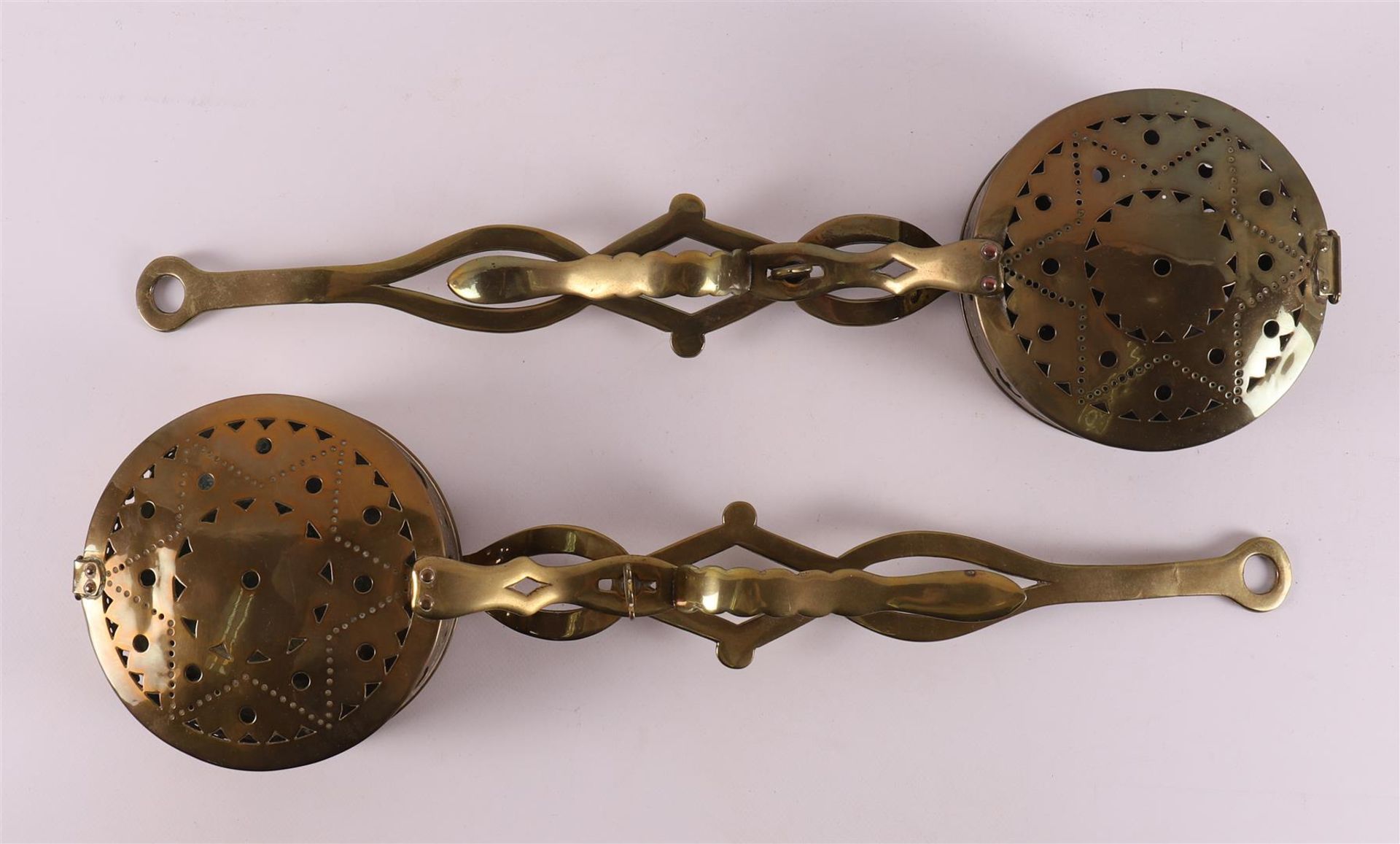 Two brass cupboard pans, England 18th century.