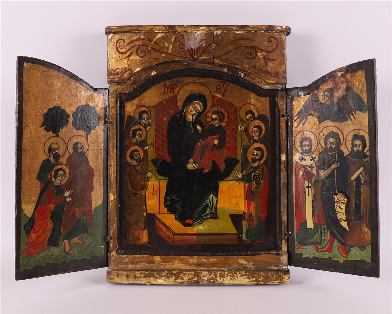 A wooden travel icon depicting Madonna and child with saints, 19th century