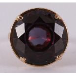 A 14 kt gold ring set with faceted colored stones.