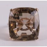 A bwg gold ring with square cut stone.