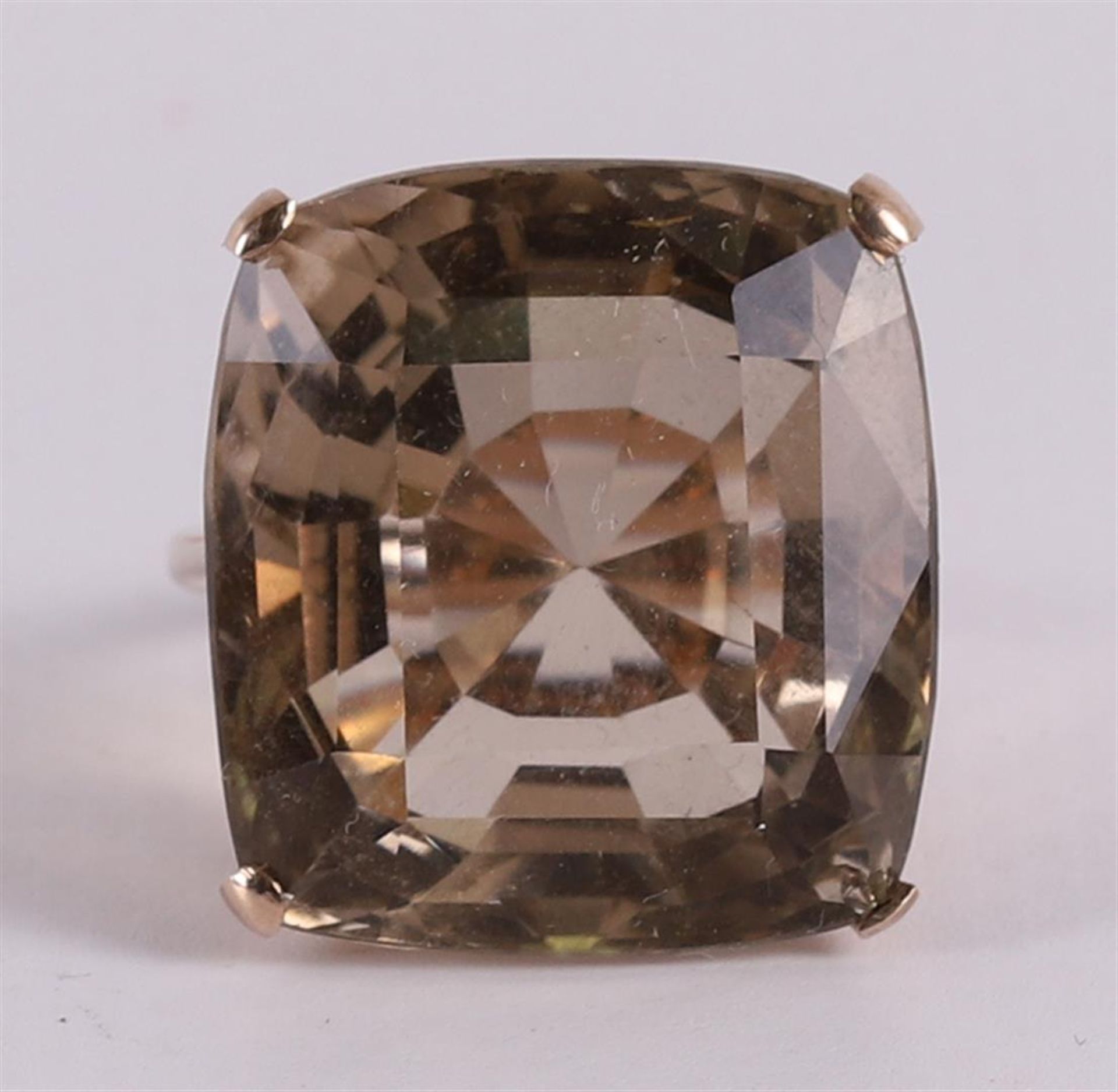 A bwg gold ring with square cut stone.