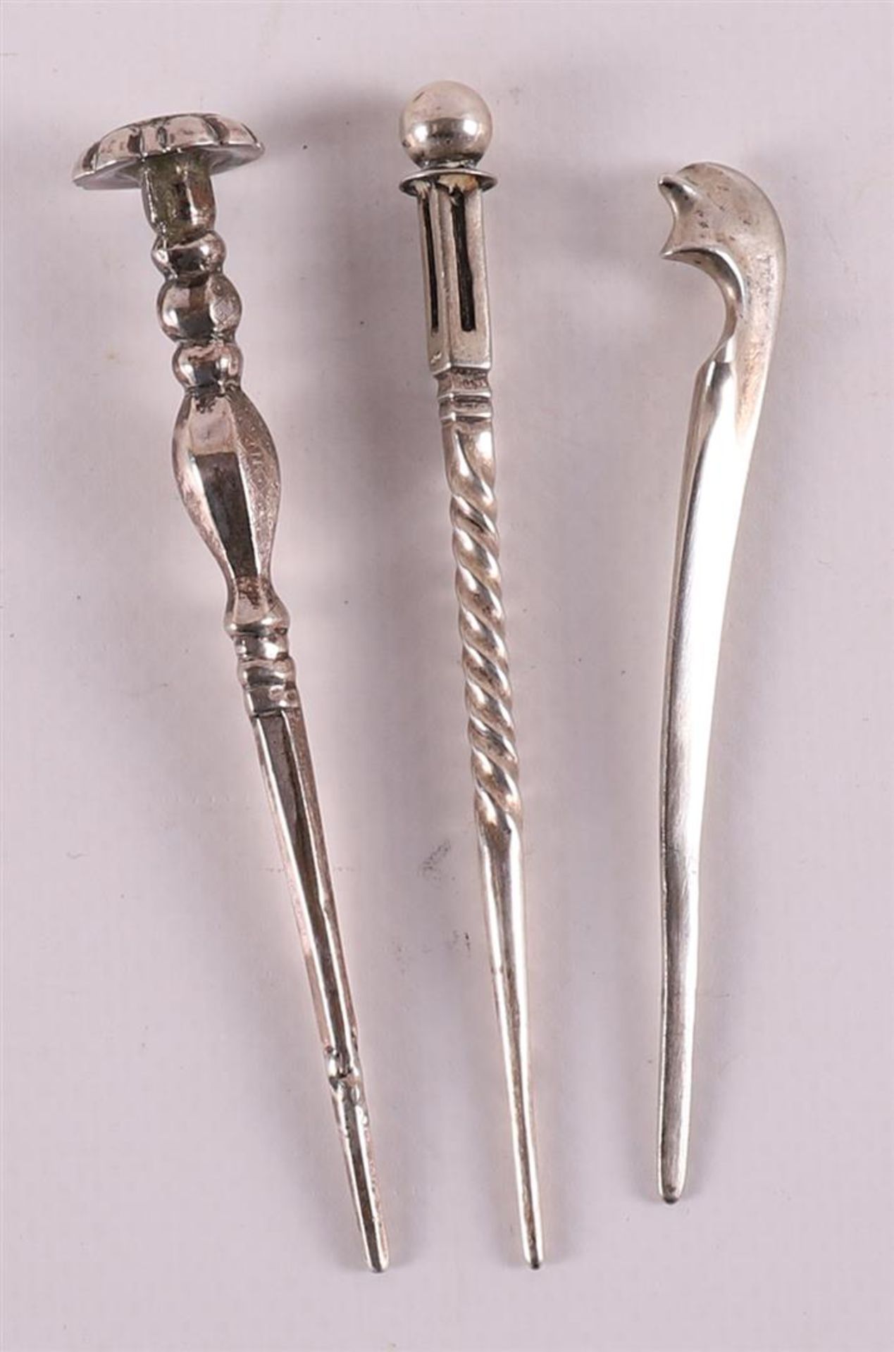 Three second grade 835/1000 silver pipe sticks, 19th century.