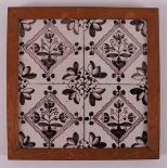 A four-step tile tableau of manganese-colored flower tiles, 18th century.