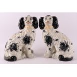 A pair of black and white earthenware dogs, England, Staffordshire, 19th century