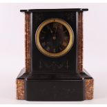 A mantel clock in black marble case, France, around 1900.