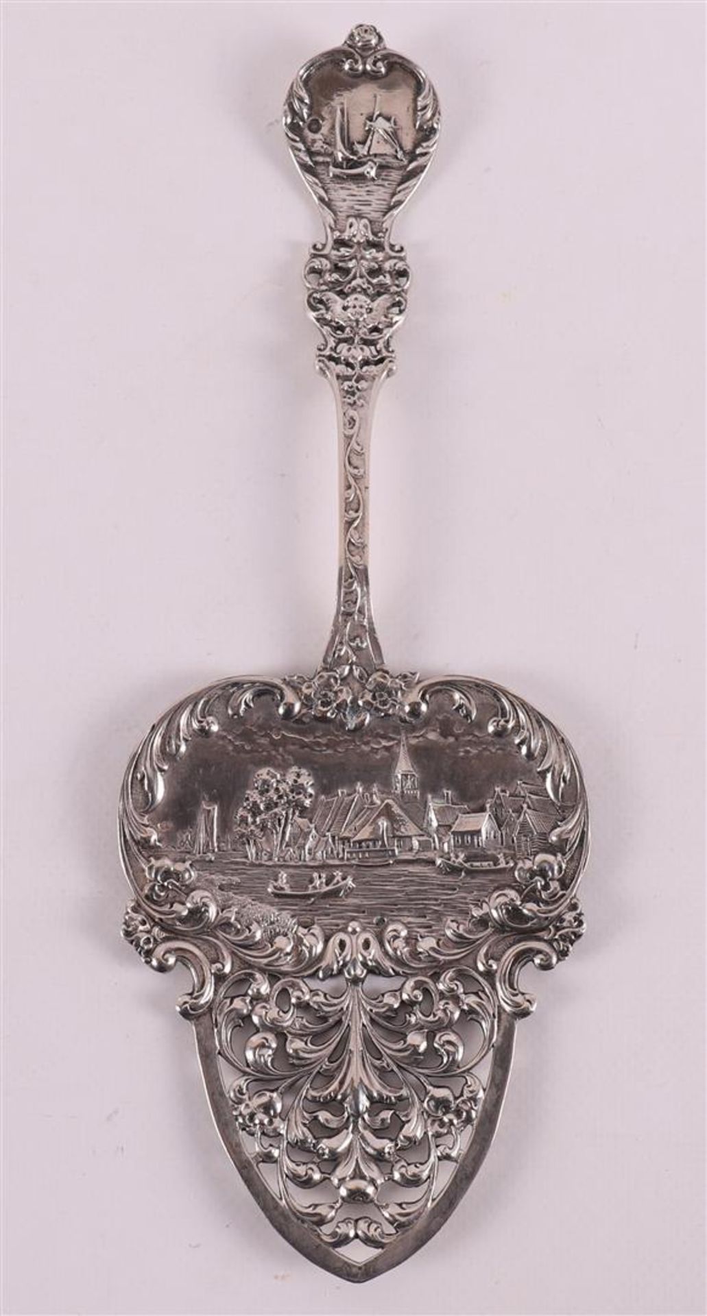 A second grade 835/1000 silver decorative spoon with a Dutch scene.